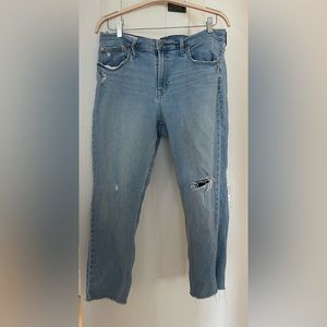 Distressed Blue Jeans with frayed knee and ankles